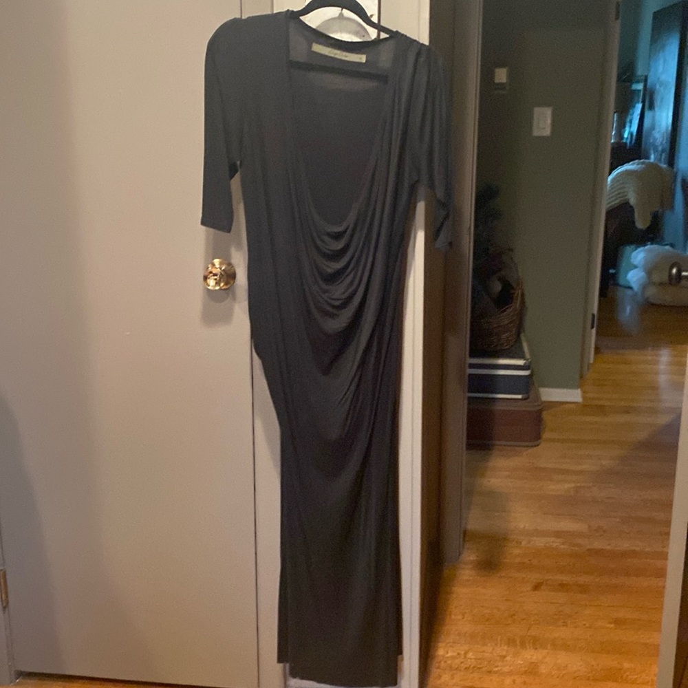 Enz Costa black jerseyy knit dress, size medium,beautiful draping in front & hip